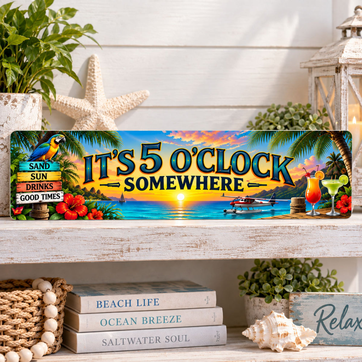 Tropical It’s 5 O’Clock Somewhere aluminum sign displayed on a bright whitewashed shelf with coastal decor.
