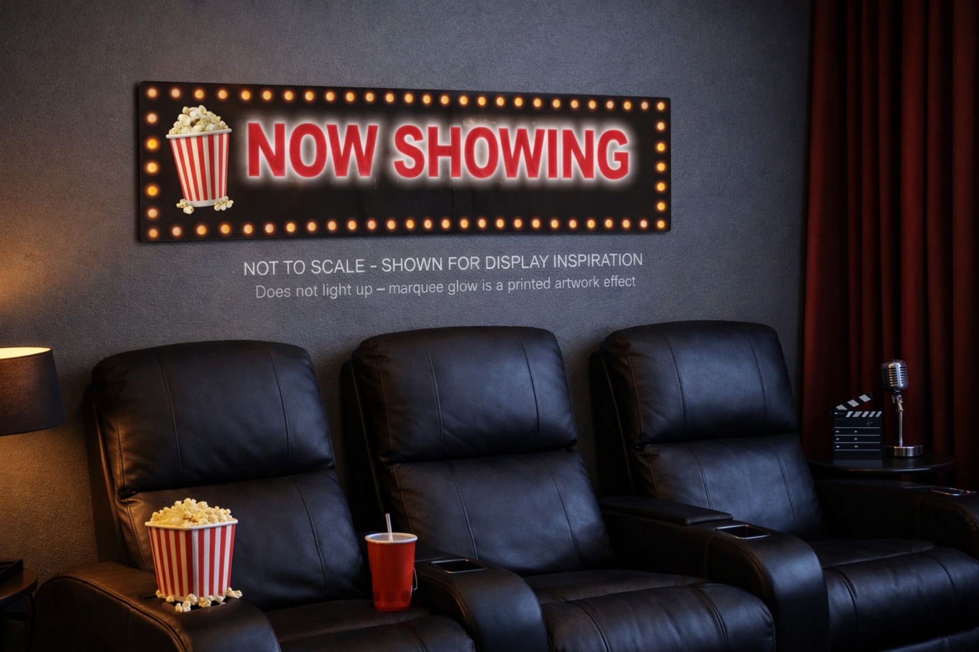 Personalized Now Showing marquee sign displayed above home theater seating, shown not to scale with printed glow effect