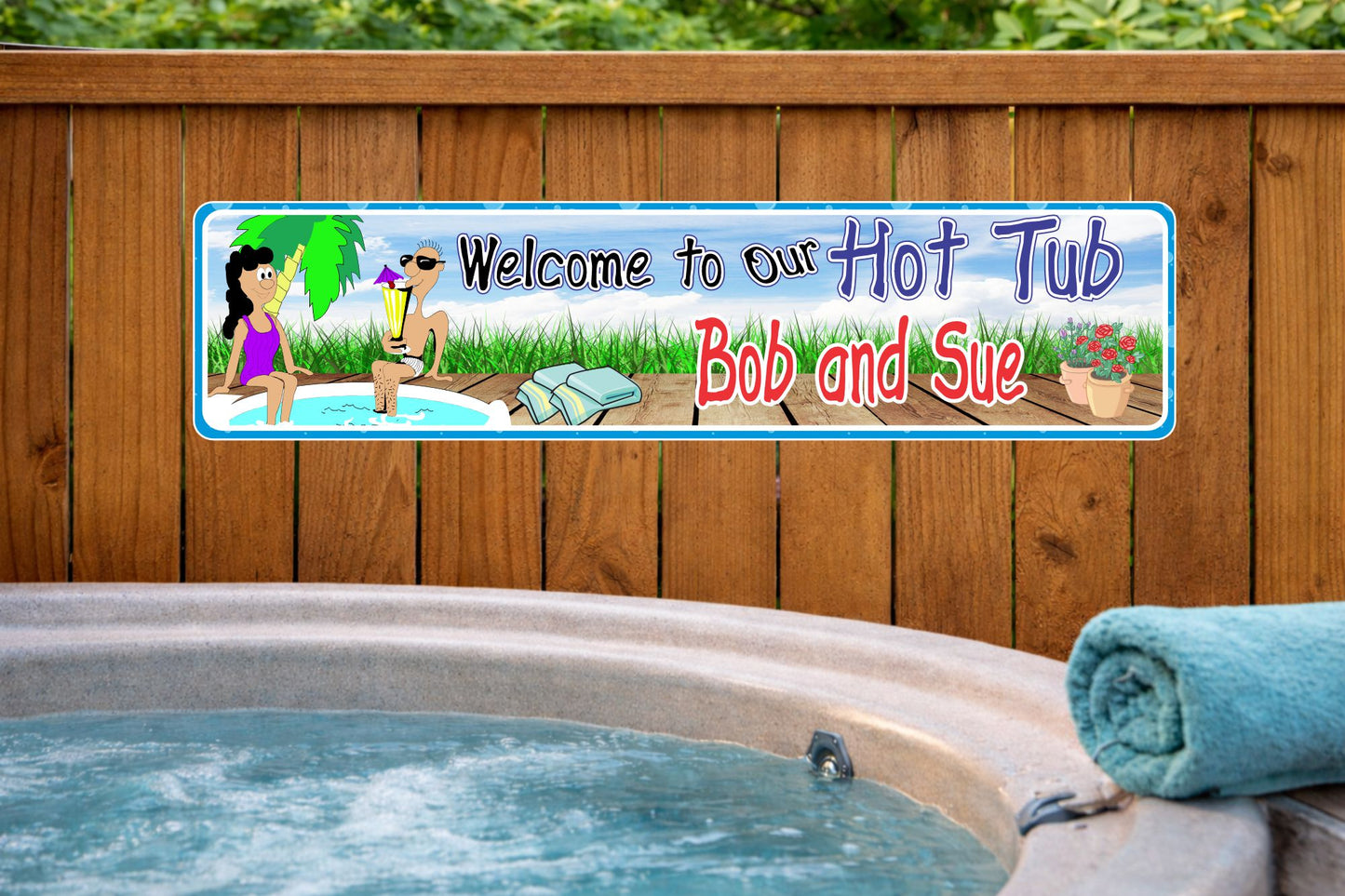 personalized hot tub sign mounted on a wooden fence beside an outdoor spa with bubbling water and a rolled towel