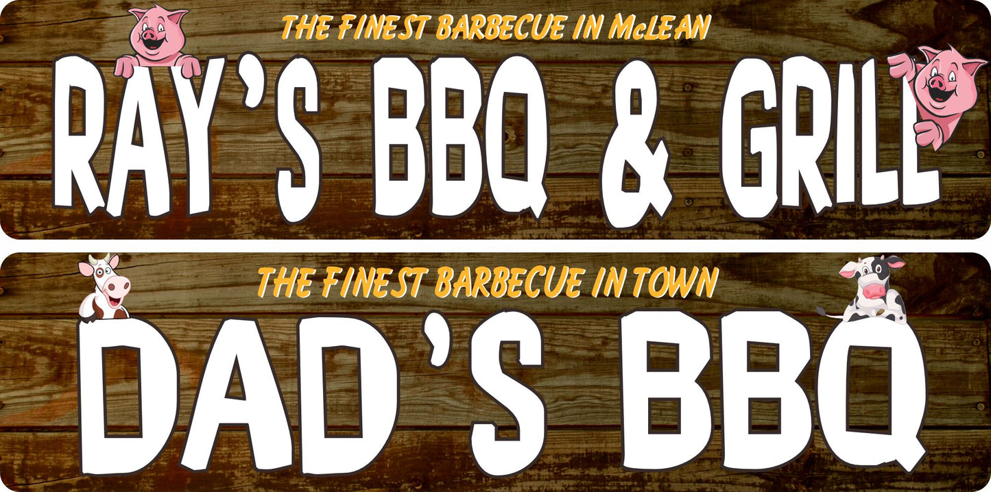 Two personalized barbecue signs displayed on rustic wood — one with pig graphics reading “Ray’s BBQ & Grill,” and one with cow graphics reading “Dad’s BBQ,” showing the available animal graphic options.