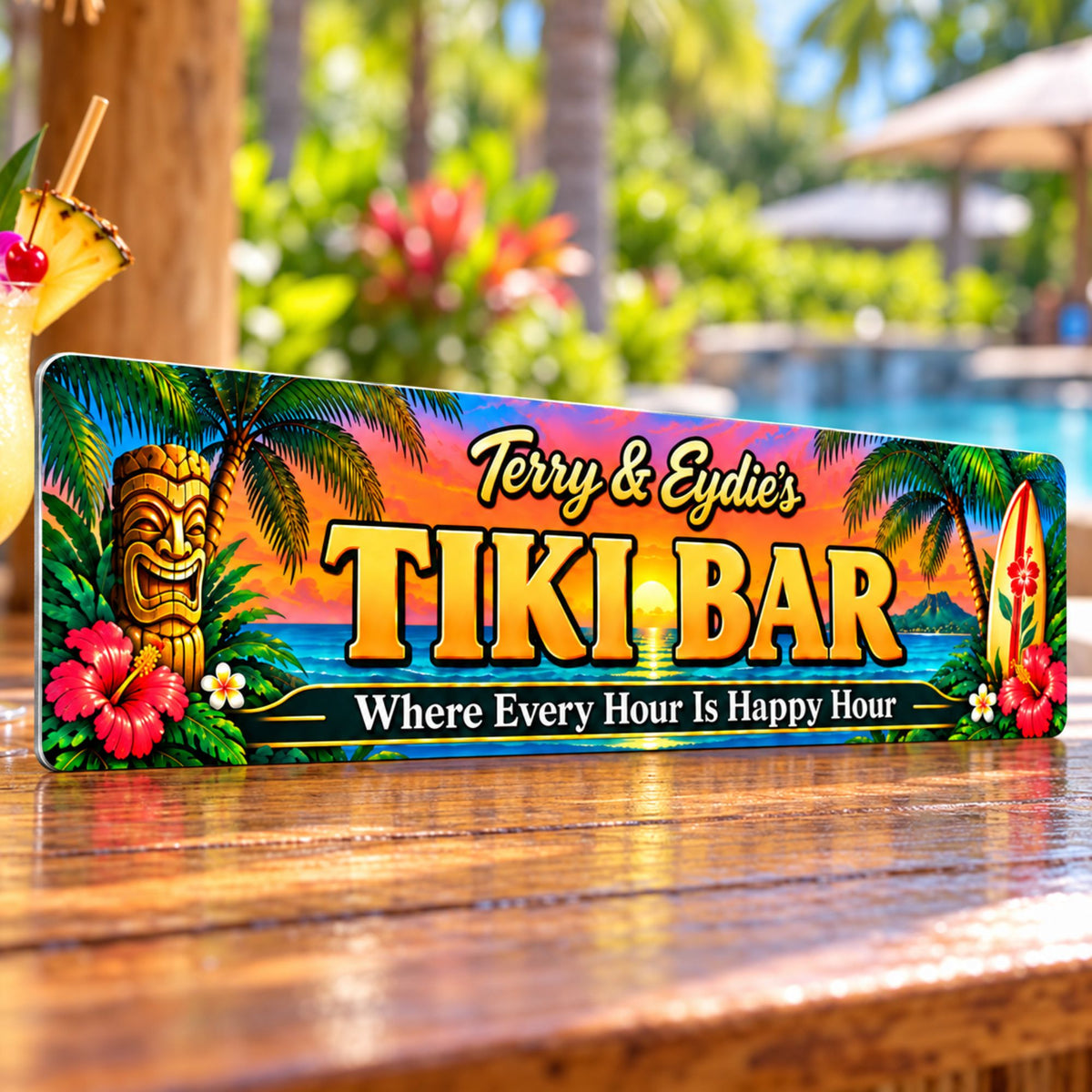 Custom tiki bar sign displayed at an angle on an outdoor wooden bartop beside a pool, showing its thin aluminum edge and colorful tropical artwork.