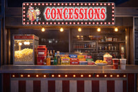 custom concessions sign styled above a home theater snack bar counter with popcorn and candy