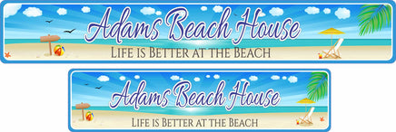 Personalized aluminum beach sign featuring an illustration of a beach with an ocean backdrop, beach chair and umbrella, sea shells, and a beach ball