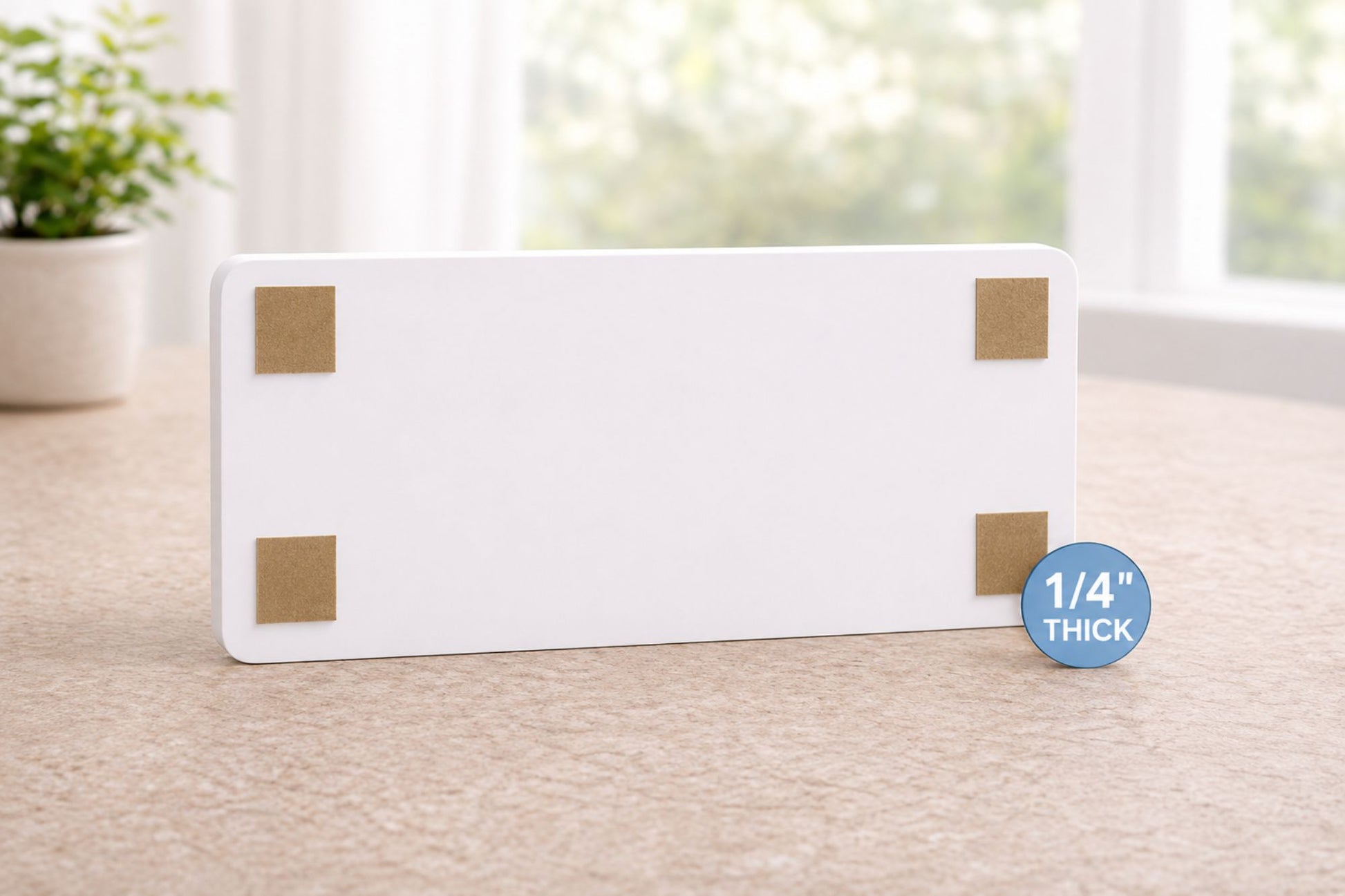 Back of kids room sign with four squares of 3M repositionable mounting tape, one in each corner