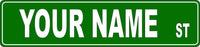 Custom street sign with green background and white lettering, personalized with your name.