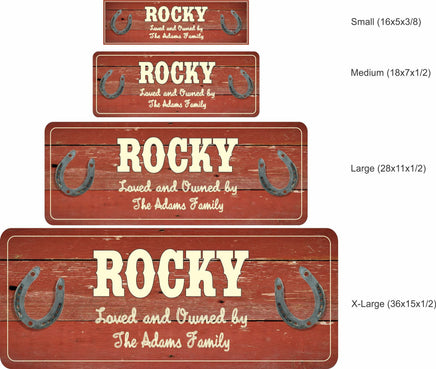 Personalized horse stall sign on red distressed barn wood with metal horseshoes, customizable text for horse and owner names.