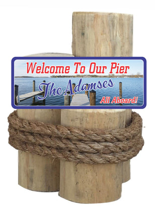 Pier Welcome Sign with Lake and Boat Dock