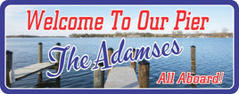 Pier Welcome Sign with Lake and Boat Dock