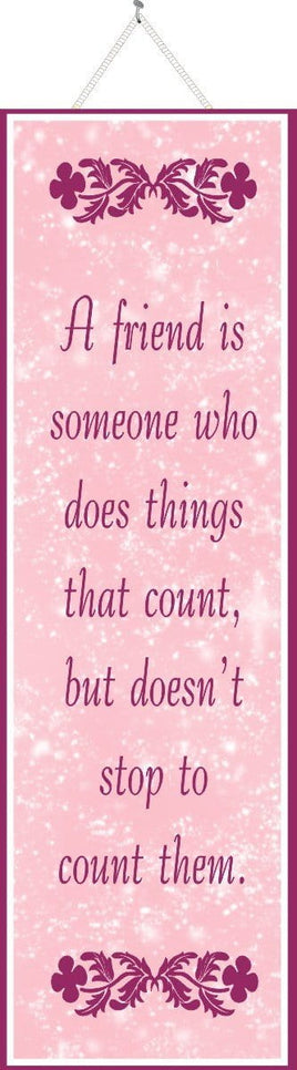 “A Friend is Someone Who Does Things That Count” Pink Friend Quote Sign with Flowers